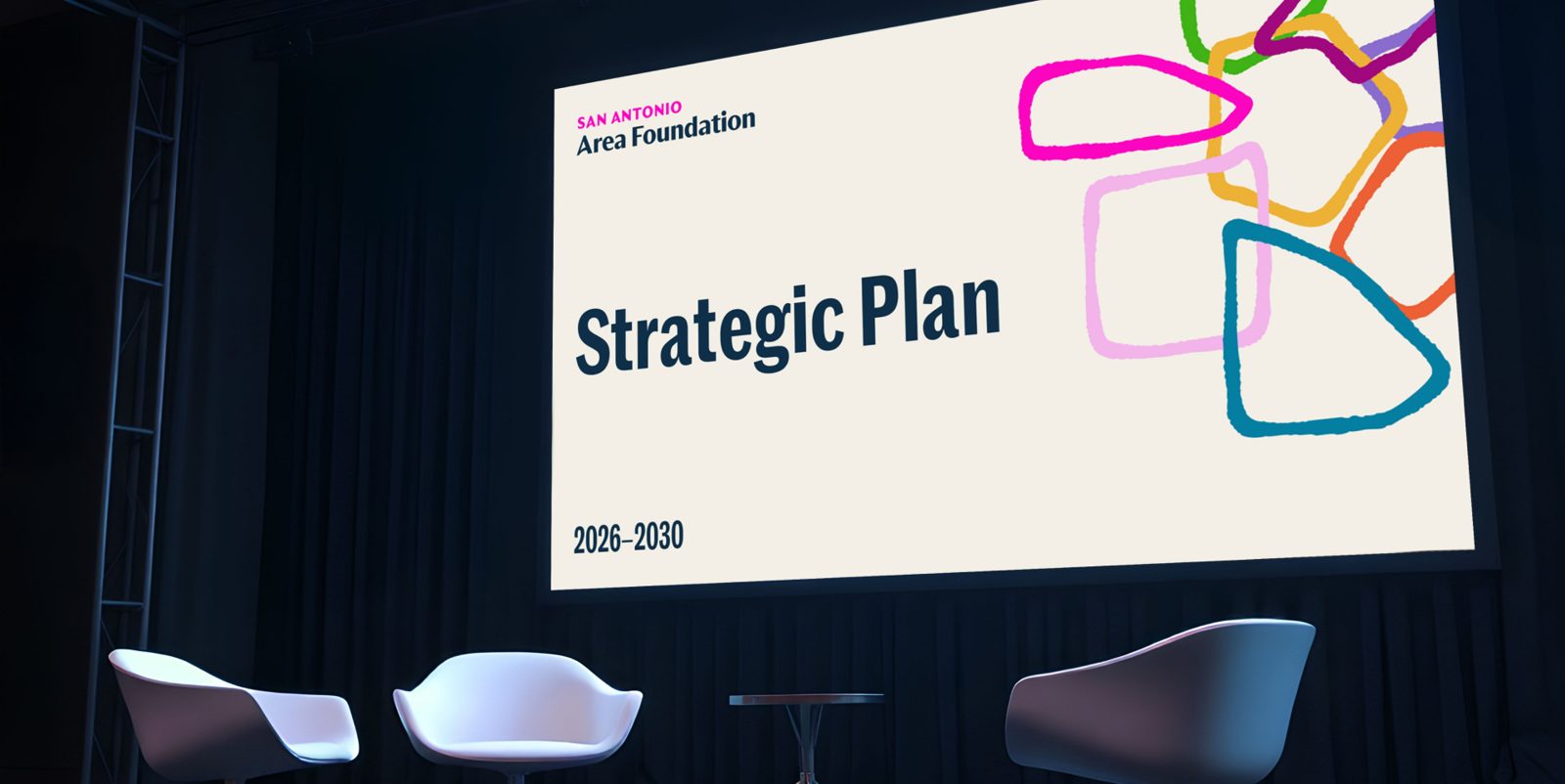 Presentation title slide on a stage screen