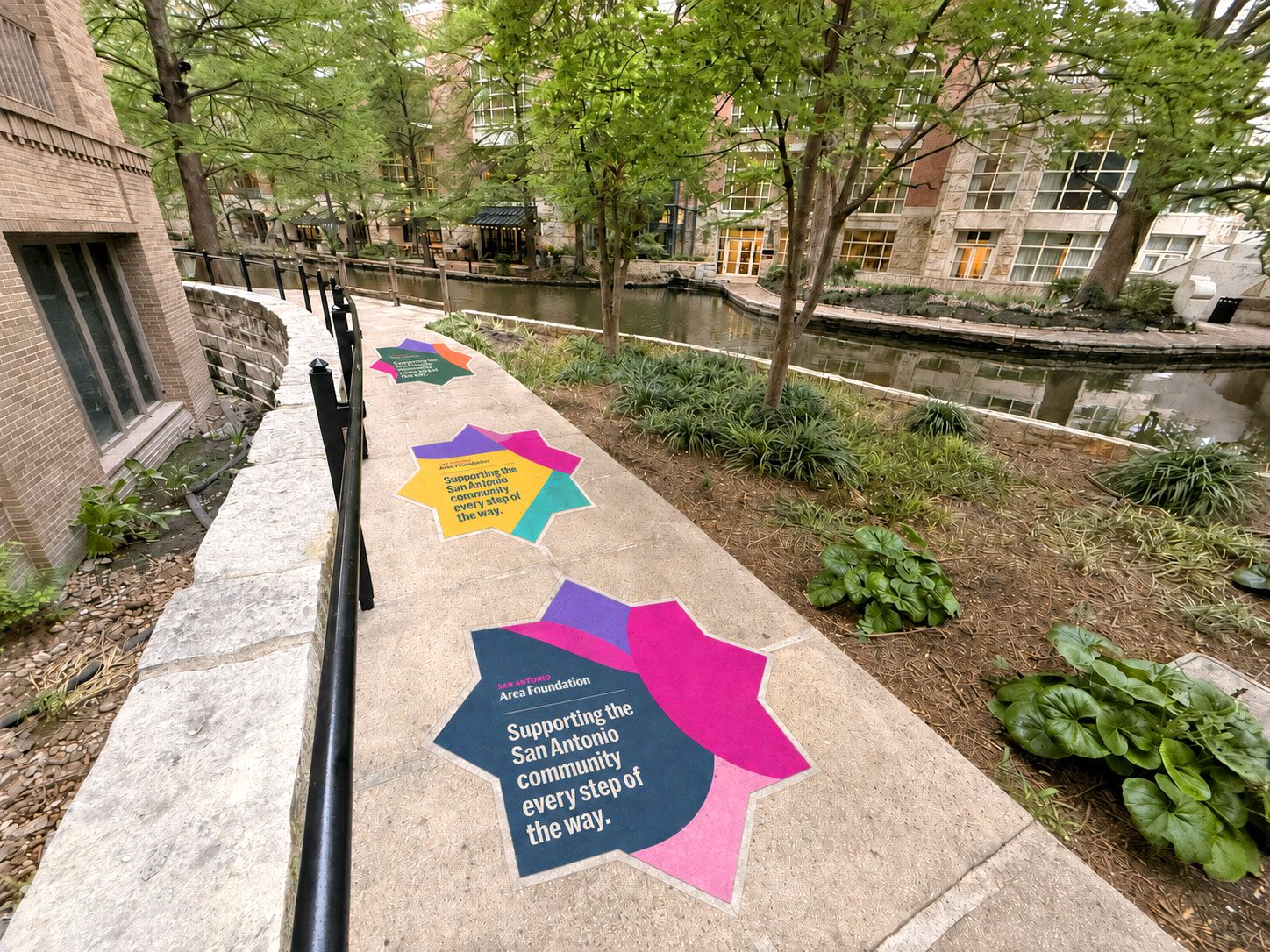 A mosaic-shaped sidewalk graphic on the River Walk