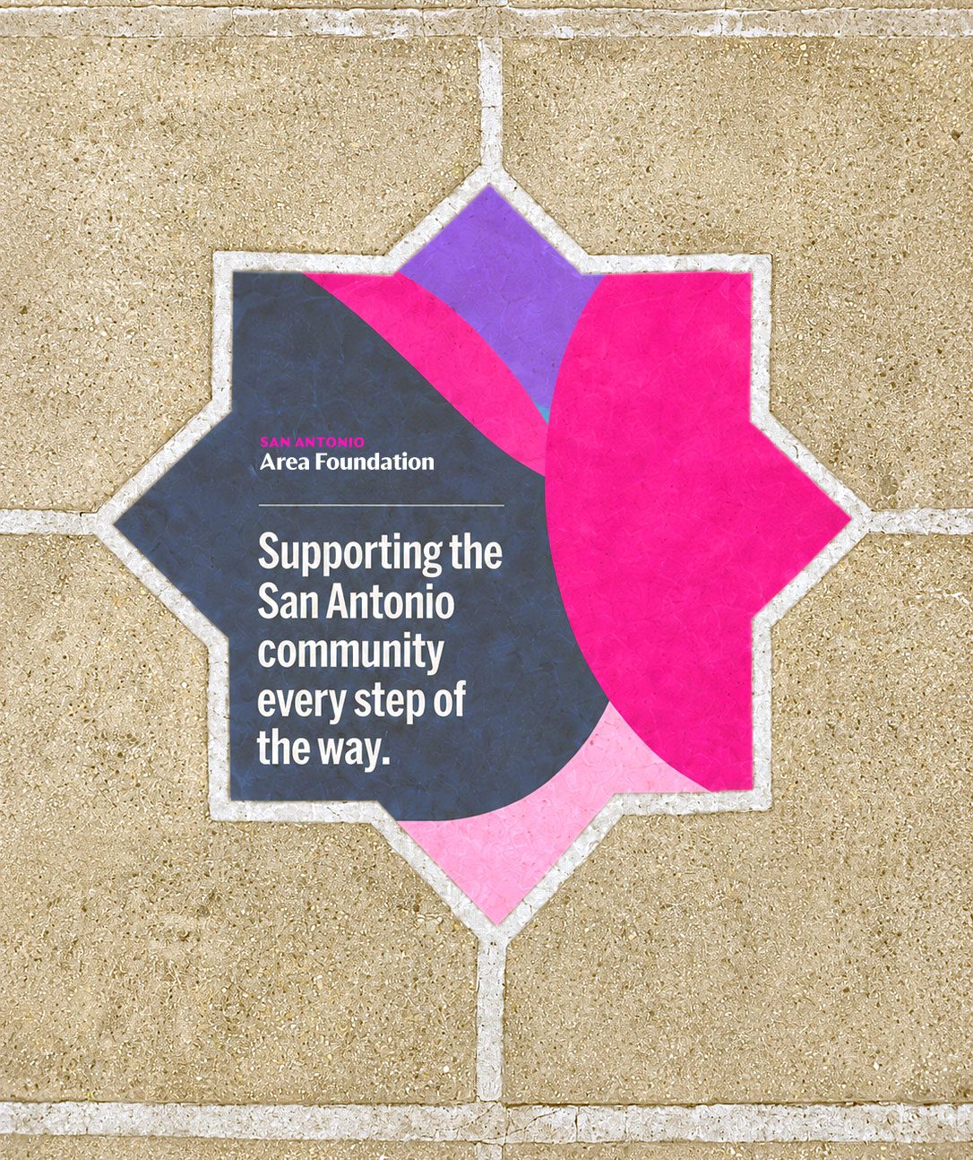 A poster in a mosaic shape pasted on a stone wall